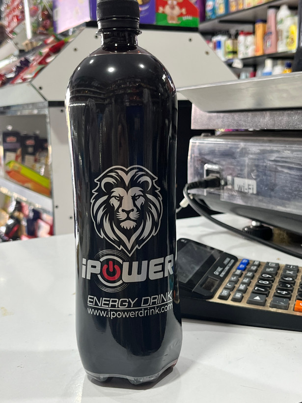 نوشابه انرژیزا گازدار آی پاور (iPower) یک لیتری به همراه یک عدد شمع جار اشانتیون